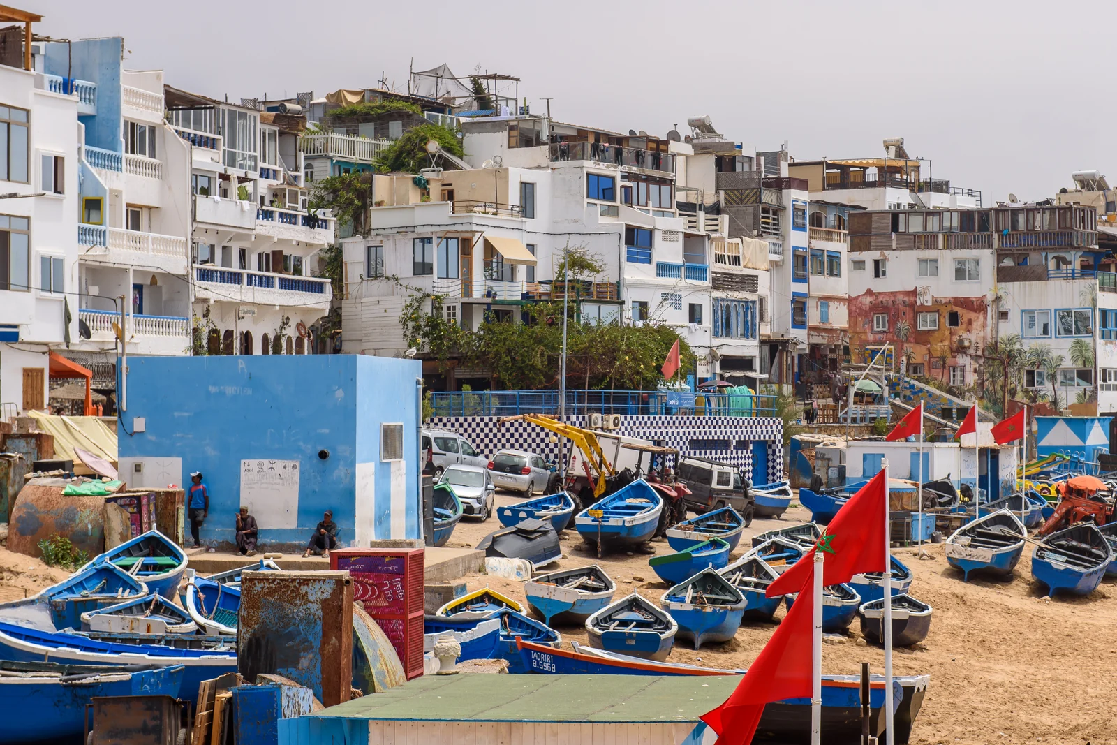 Fishing boats and village houses on Taghazout beach